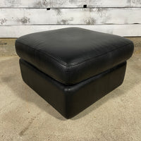 Pouf en cuir noir